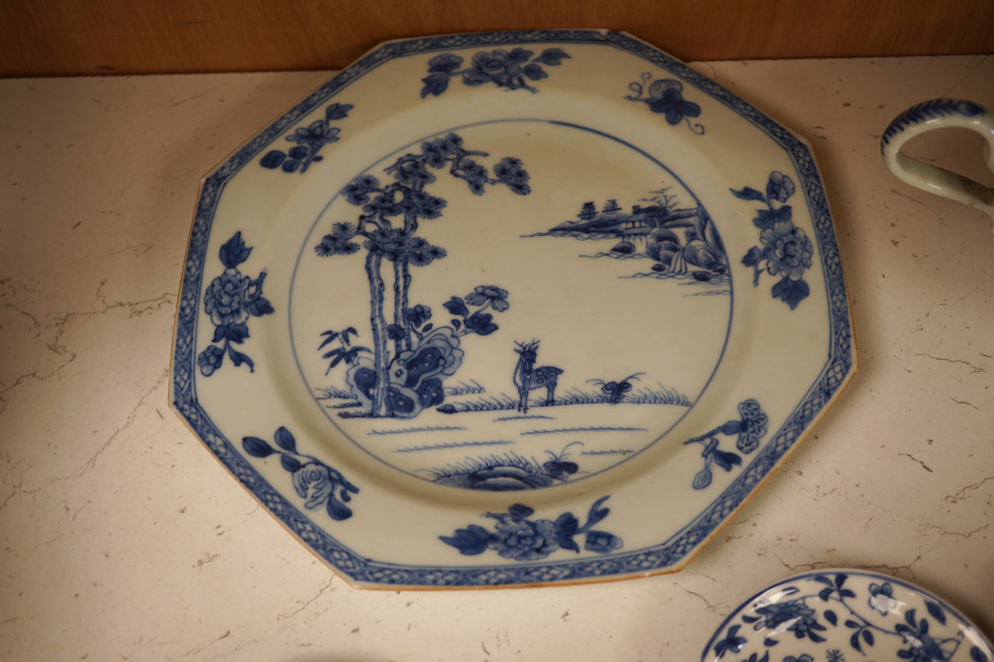 A Chinese export blue and white blue plate, sauceboat and Ko-sometsuke type dish together with a miniature tea bowl and two saucers. Plate 22cm diameter
